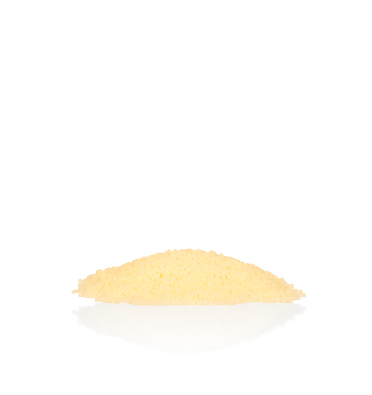 Image of a pile of yellow wax beads to represent Village Craft & Candles Yellow Beeswax Pastilles || Image d'un tas de perles de cire jaune pour représenter les pastilles de cire d'abeille jaune de Village Craft & Candles