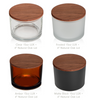 LUX Jars: Amber, Clear, Frosted White, & Matte Black. Great for Retail. Available in 16oz Max Capacity, 13oz Recommended Fill. Case of 12, Wood Lid Options: Acacia, Natural Oak or White Pine (Sold Separately) || Pots LUX : Ambre, Transparent, Blanc Givré et Noir Mat. Idéaux pour la vente au détail. Disponibles en capacité maximale de 16 oz, remplissage recommandé à 13 oz. Boîte de 12, Options de couvercle en bois : Acacia, Chêne Naturel ou Pin Blanc (Vendus séparément)