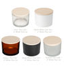 Five 15oz LUX Jars in different colors (Clear, Matte White, Amber, Matte Black, Frosted) each topped with a White Pine wood lid. || Cinq Pots LUX 15oz de différentes couleurs (Transparent, Blanc Mat, Ambré, Noir Mat, Givré) chacun avec un couvercle en bois Pin Blanc.