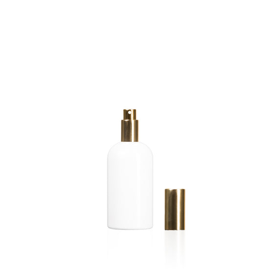 Image of a plastic white bottle with a gold lid on a white background to represent Village Craft & Candle's 7oz Boston Round bottles 