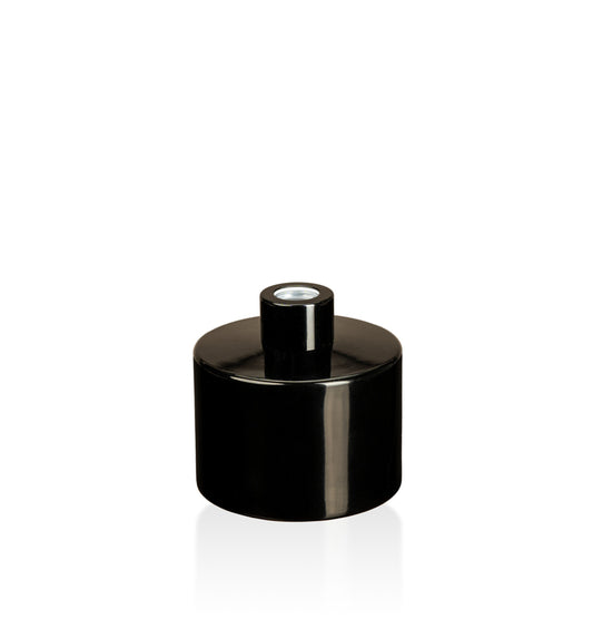 Image of a stout black glass diffuser bottle with a black collar on a white background to represent Village Craft & Candle's Lavish Diffuser Bottle. 