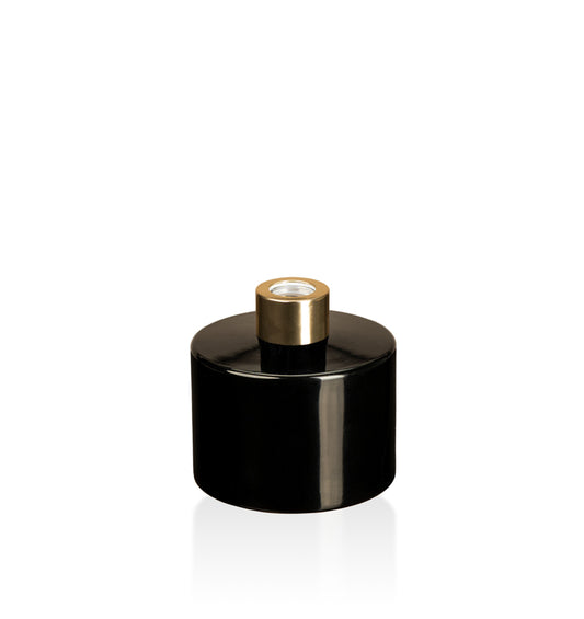 Image of a stout black glass diffuser bottle with a gold collar on a white background to represent Village Craft & Candle's Lavish Diffuser Bottle. 