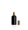 Image of a plastic black bottle with a gold lid on a white background to represent Village Craft & Candle's 7oz Boston Round bottles || Image d'une bouteille en plastique noire avec un couvercle doré sur fond blanc pour représenter les bouteilles rondes Boston de 7 oz de Village Craft & Candle