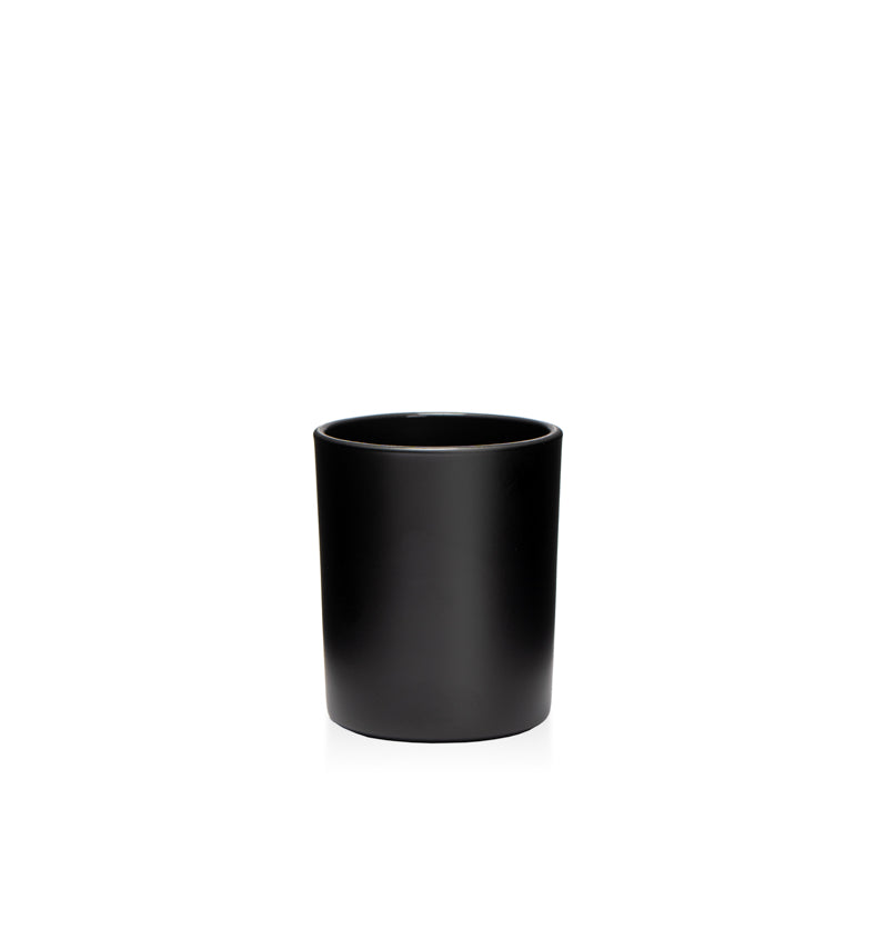 Image of a matte black glass vessel on a white background to represent the Village Craft & Candle 4oz Matte Black LUX jar || Image d'un récipient en verre noir mat sur un fond blanc représentant le pot LUX noir mat de 4 oz de Village Craft & Candle.