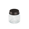 Image of a Black Satin Metal lid on a clear glass jar to represent the Village Craft & Candle Black Satin Country Lid for Candle Making and Crafting || Image d’un couvercle en métal Satin Noir sur un pot en verre transparent pour représenter le couvercle Country Satin Noir de Village Craft & Candle pour la fabrication de bougies et l’artisanat.