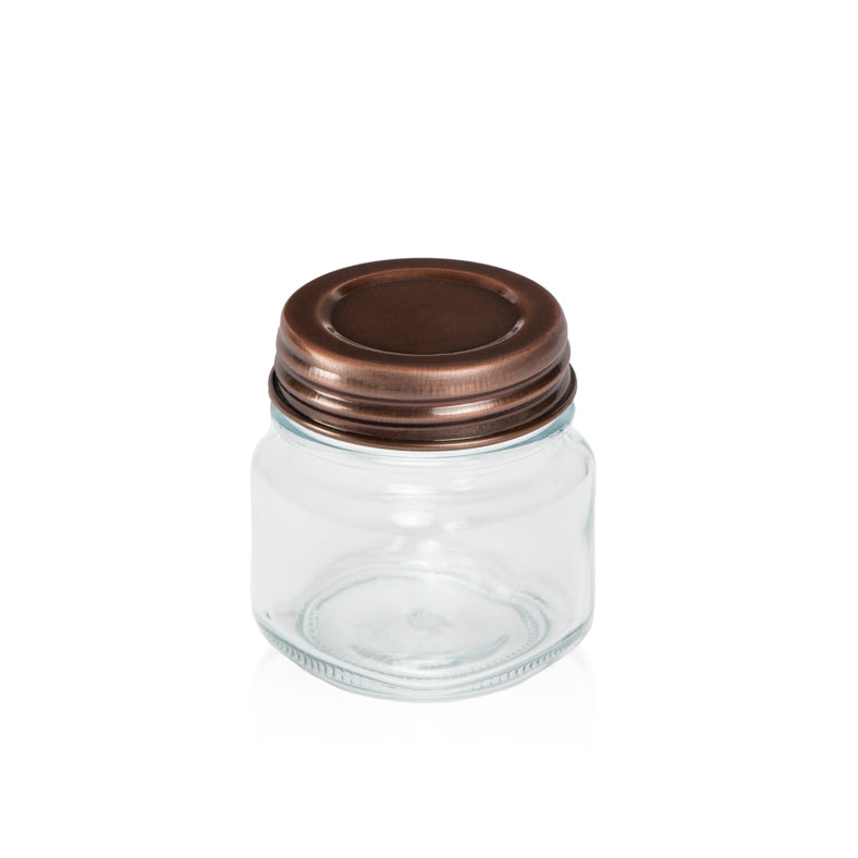 Image of a Copper Metal lid on a clear glass jar to represent the Village Craft & Candle Copper Country Lid for Candle Making and Crafting || Image d’un couvercle en métal Cuivre sur un pot en verre transparent pour représenter le couvercle Country Cuivre de Village Craft & Candle pour la fabrication de bougies et l’artisanat.