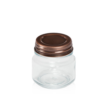 Image of a Copper Metal lid on a clear glass jar to represent the Village Craft & Candle Copper Country Lid for Candle Making and Crafting || Image d’un couvercle en métal Cuivre sur un pot en verre transparent pour représenter le couvercle Country Cuivre de Village Craft & Candle pour la fabrication de bougies et l’artisanat.