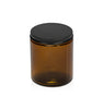 Image of an amber glass jar with a low profile matte black lid to represent Village Craft & Candle's 8oz Amber Element Straight Side Jar & Midnight Black Lid for candle making || Image d'un pot en verre ambre avec un couvercle noir mat à profil bas représentant le pot droit Element ambre de 8 oz et le couvercle noir Minuit de Village Craft & Candle pour la fabrication de bougies