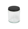 Image of a clear glass jar with a low profile matte black lid to represent Village Craft & Candle's 8oz Clear Flint Element Straight Side Jar & Midnight Black Element Lid for candle making || 
Image d'un pot en verre transparent avec un couvercle noir mat à profil bas représentant le pot droit Element Flint clair de 8 oz et le couvercle noir Minuit Element de Village Craft & Candle pour la fabrication de bougies.