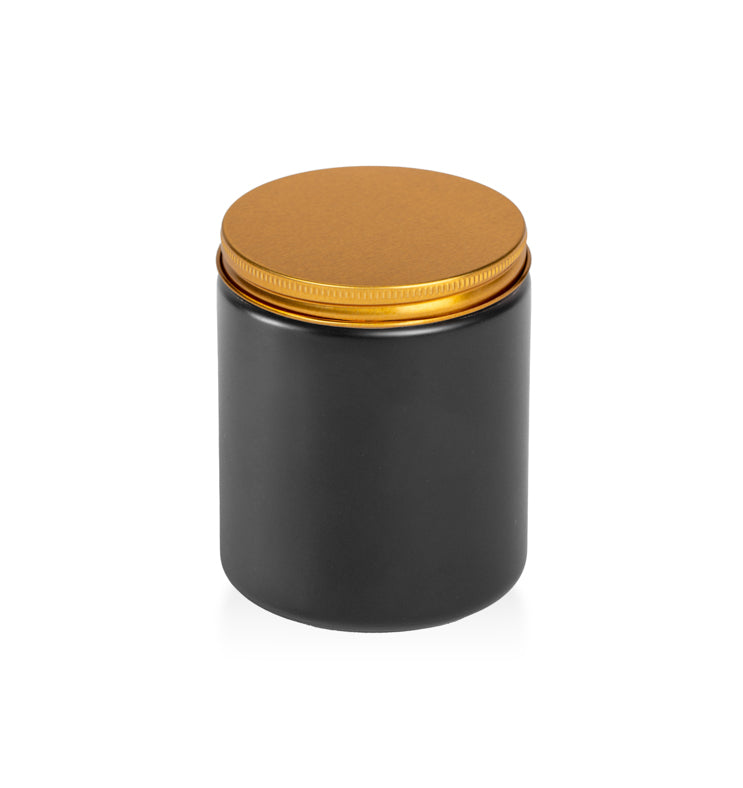 Image of a matte black glass jar with low profile gold lid to represent Village Craft & Candle's Matte Black Element Straight Side Jar & Classic Gold Element Lid for candle making || Image d'un pot en verre noir mat avec un couvercle doré à profil bas représentant le pot droit noir mat Element et le couvercle doré classique Element de Village Craft & Candle pour la fabrication de bougies.