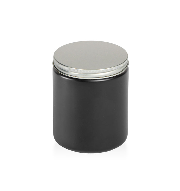 Image of a matte black glass jar with low profile silver lid to represent Village Craft & Candle's Matte Black Element Straight Side Jar & Silver Element Lid for candle making || Image d'un pot en verre noir mat avec un couvercle argenté à profil bas représentant le pot droit noir mat Element et le couvercle argenté Element de Village Craft & Candle pour la fabrication de bougies.