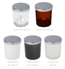 Five 9oz LUX Jars in different colors (Clear, Amber, Matte White, Matte Black, Frosted) each topped with a 3-inch Silver LUX Metal Lid. || Cinq Pots LUX 9oz de différentes couleurs (Transparent, Ambré, Blanc Mat, Noir Mat, Givré) chacun coiffé d'un Couvercle Métallique LUX Argent 3 pouces.