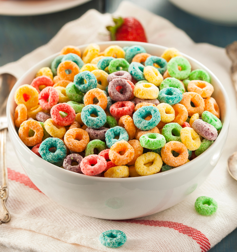 Bowl of multi-coloured, round shaped cereal as a visual representation of Fruit Loops Fragrance Oil available at Village Craft and Candle || Bol de céréales multicolores de forme ronde comme représentation visuelle de l'huile parfumée Fruit Loops disponible chez Village Craft and Candle