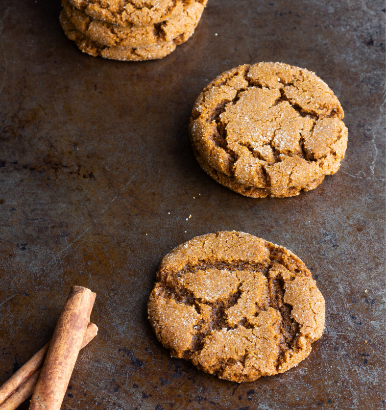 Ginger cookies with encrusted salt on wood table as a visual representation of Gingersnap Cookie Fragrance Oil available at Village Craft and Candle || Biscuits au gingembre avec du sel incrusté sur une table en bois comme représentation visuelle de l'huile parfumée Gingersnap Cookie disponible chez Village Craft and Candle