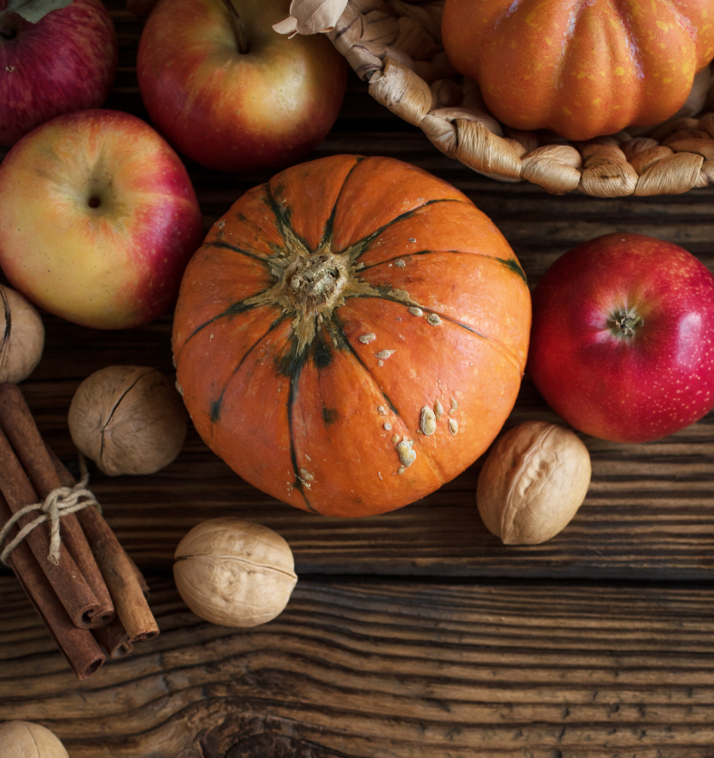 Wood bowl with autumn spices and nuts as a visual representation of Harvest Jubilee Fragrance Oil available at Village Craft and Candle || Bol en bois avec des épices d'automne et des noix comme représentation visuelle de l'huile parfumée Harvest Jubilee disponible chez Village Craft and Candle