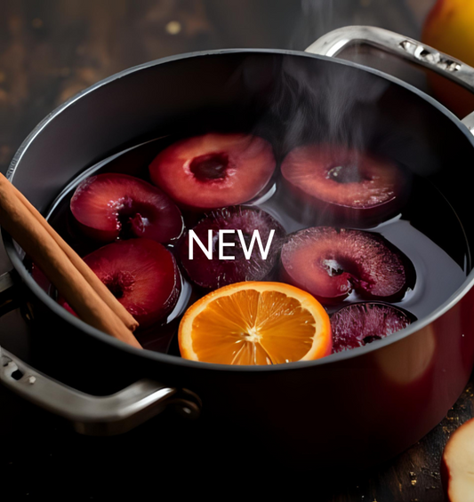 Mulled Plum Fragrance Oil represented by simmering plums with orange slices and cinnamon sticks, capturing a warm, fruity, spiced aroma 
