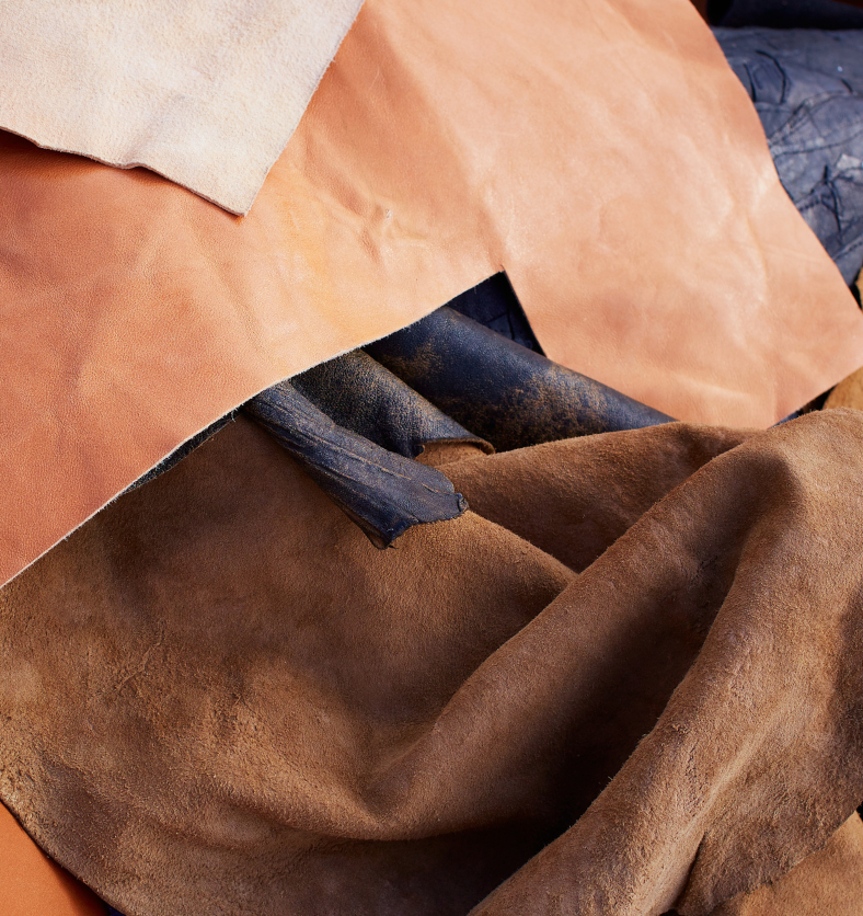 Pieces of suede as a visual representation of Suede Fragrance Oil available at Village Craft and Candle || Morceaux de suède comme représentation visuelle de l'huile parfumée Suède disponible chez Village Craft and Candle.