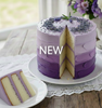 An image of a vanilla layer cake with textured purple ombre buttercream frosting & dried lavender buds. This image represents the Vanilla Lavender Buttercream fragrance oil, highlighting notes of sweet cream and floral lavender. || Une image d'un gâteau à étages à la vanille avec un glaçage à la crème au beurre texturé en dégradé de violet et des boutons de lavande séchés. Cette image représente l'huile parfumée Crème au beurre vanille et lavande, mettant en valeur des notes de crème sucrée et de lavande.