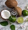 Coconut and limes on a granite countertop with a mindfulness graphic as a visual representation of Verbena Coco-Lime EmotiScents (Well Being) Fragrance Oil available at Village Craft and Candle || Noix de coco et citrons verts sur un comptoir en granit avec un graphique de pleine conscience comme représentation visuelle de l'huile parfumée Verveine Coco-Lime EmotiScents (Bien-être) disponible chez Village Craft and Candle